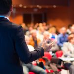 Speaker at a conference.